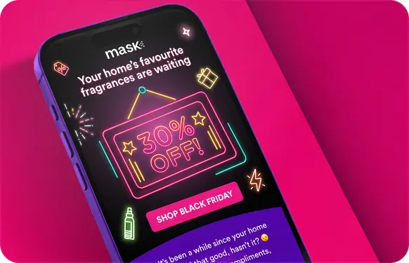 Phone showing a MaskCo email with a neon 30% off sign and a Shop Black Friday button, on hot pink