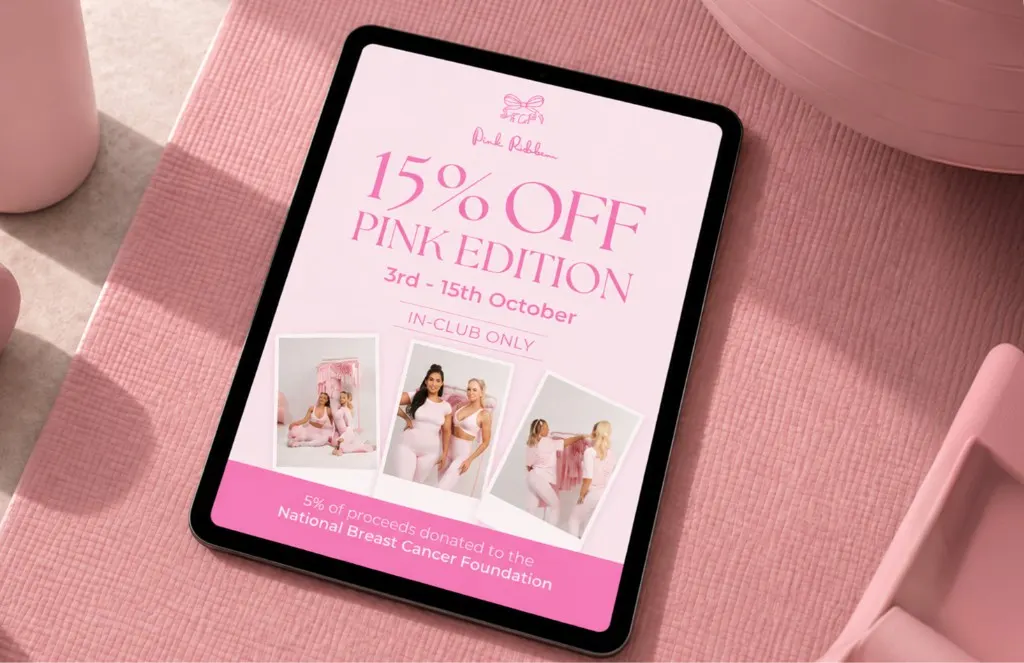 Tablet on a pink mat showing SpeedFit's 15% off Pink Edition offer, with photos of women in pink activewear