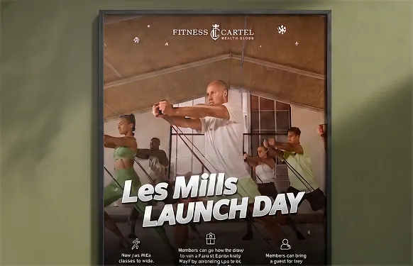 Framed Fitness Cartel poster of a group class mid-workout for Les Mills Launch Day, on an olive wall