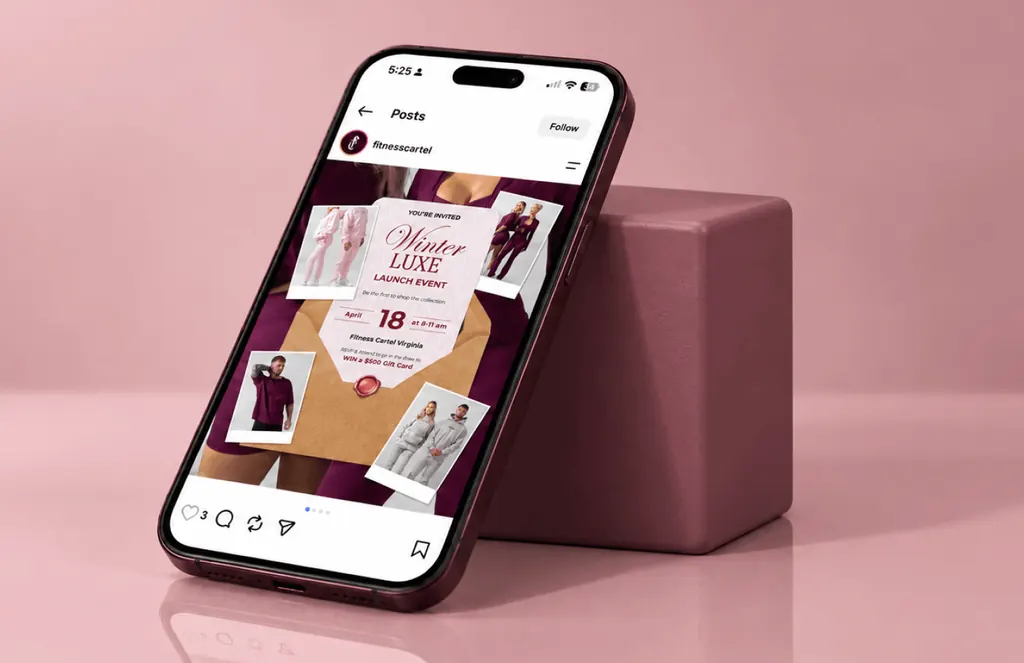 Phone showing a Fitness Cartel Instagram post inviting followers to the Winter Luxe launch event, on pink
