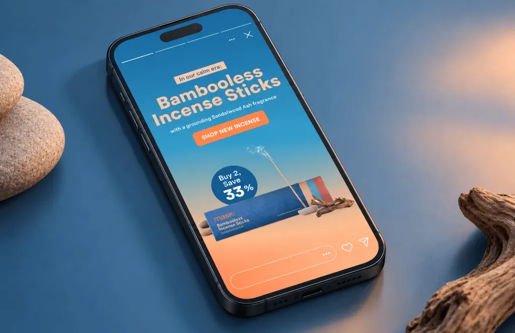 Phone showing a MaskCo Instagram story for Bambooless Incense Sticks, buy 2 save 33%, beside pebbles and driftwood